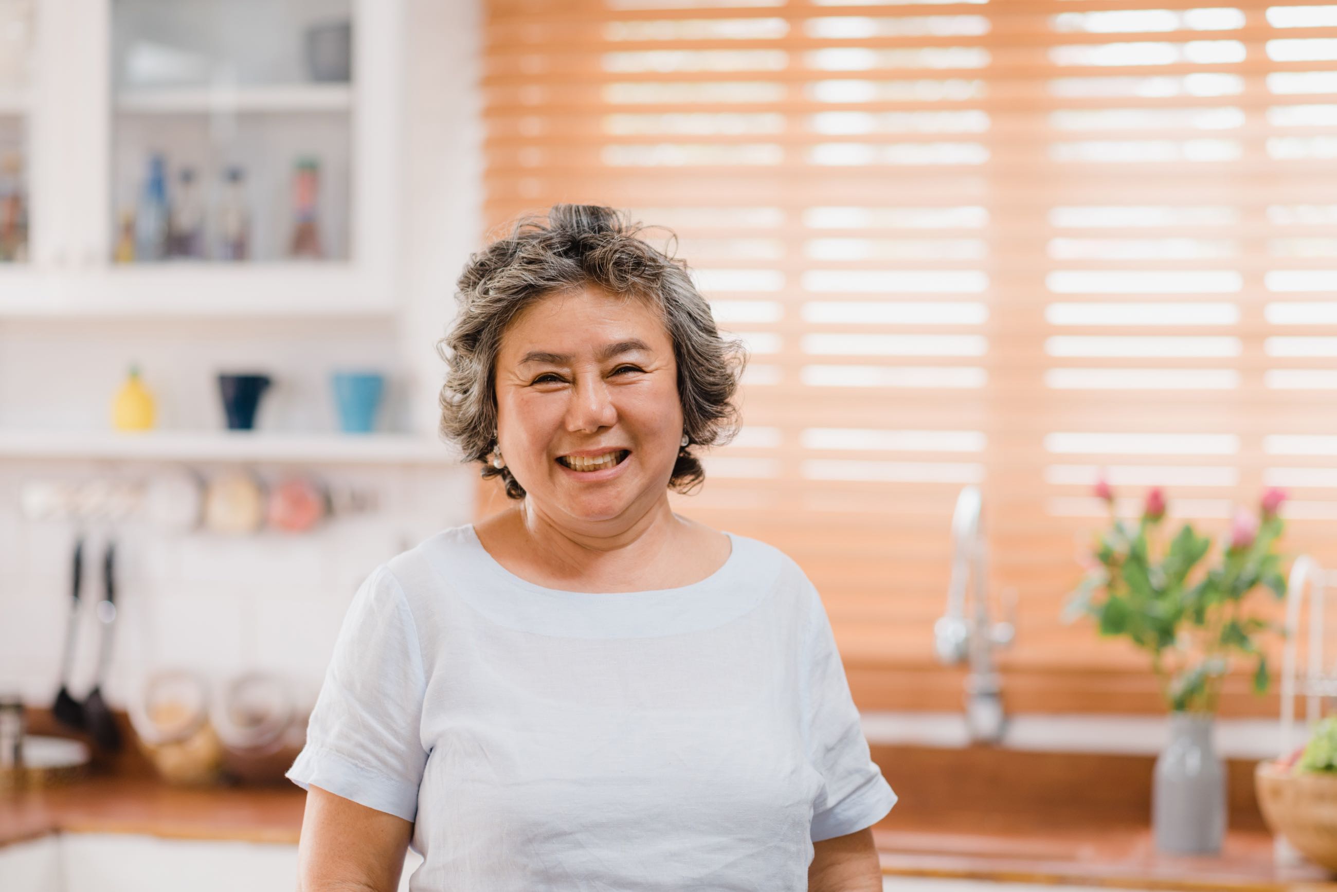 asian-elderly-woman-feeling-happy-smiling-looking-camera-while-relax-kitchen-home.jpg